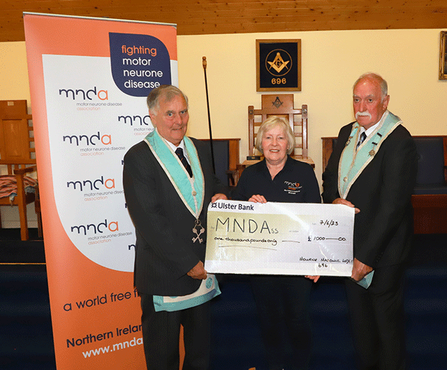 The Worshipful Master W.Bro.Kenny Newell and the treasurer W.Bro. Cyril Sargent present a cheque for £1,000 to the Motor Neuron Disease Association.